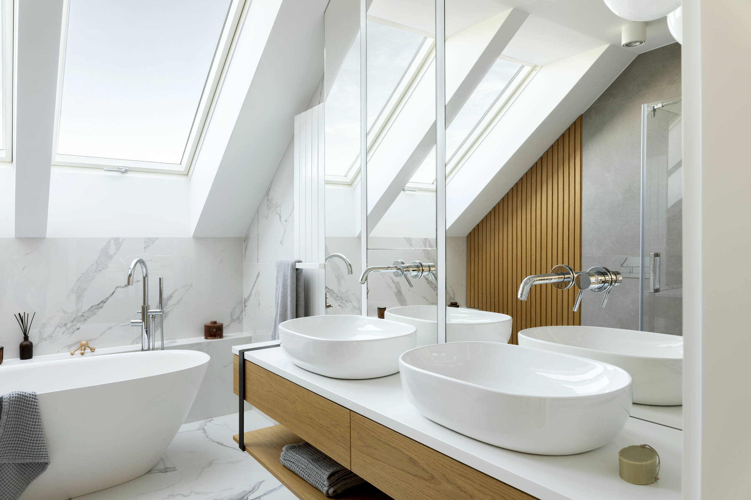 Stylish bathroom interior design with marble panels bathtub towels other personal bathroom accessories modern glamour interior concept roof window template